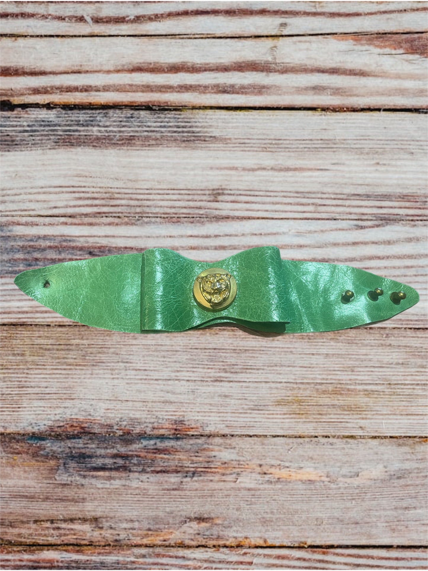 Wildcat Charm: Handmade Green Leather Bow Cuff Bracelet with Gold Wildcat Button