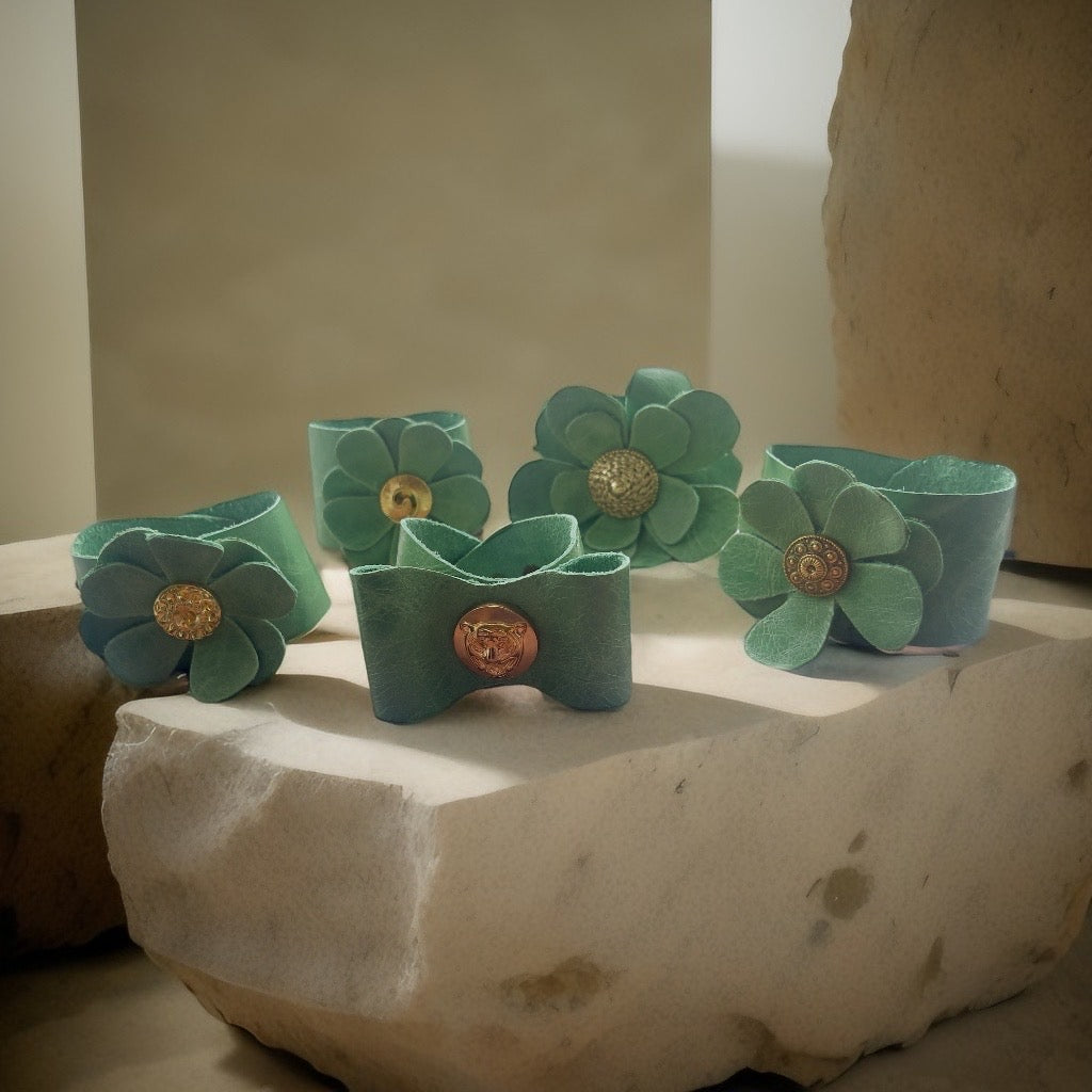 Green Leather Flower Cuff Bracelet with Swirl Button Detail.